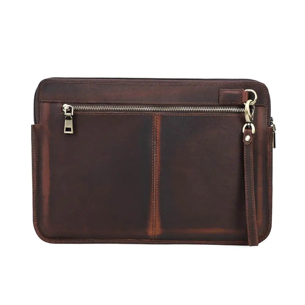 Brown leather clutch bag with zippers on a white background