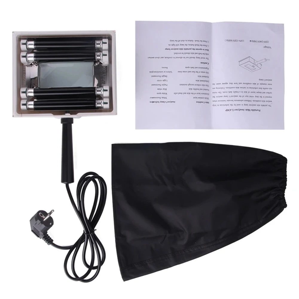 Black hair straightening device with packaging, manual, and plug on a white background