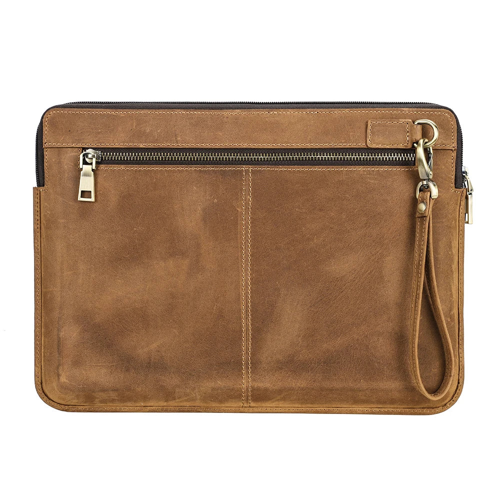 Brown leather clutch bag with a strap on a white background