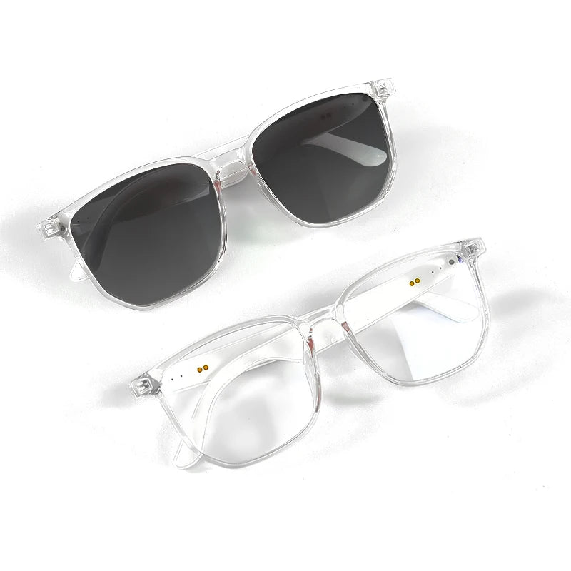 Two pairs of sunglasses with clear frames and dark lenses on a white background