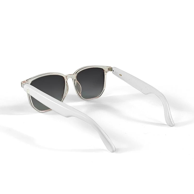 Sunglasses with white frame and dark lenses on a white background