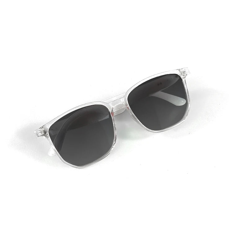Sunglasses with silver frame and dark lenses on a white background