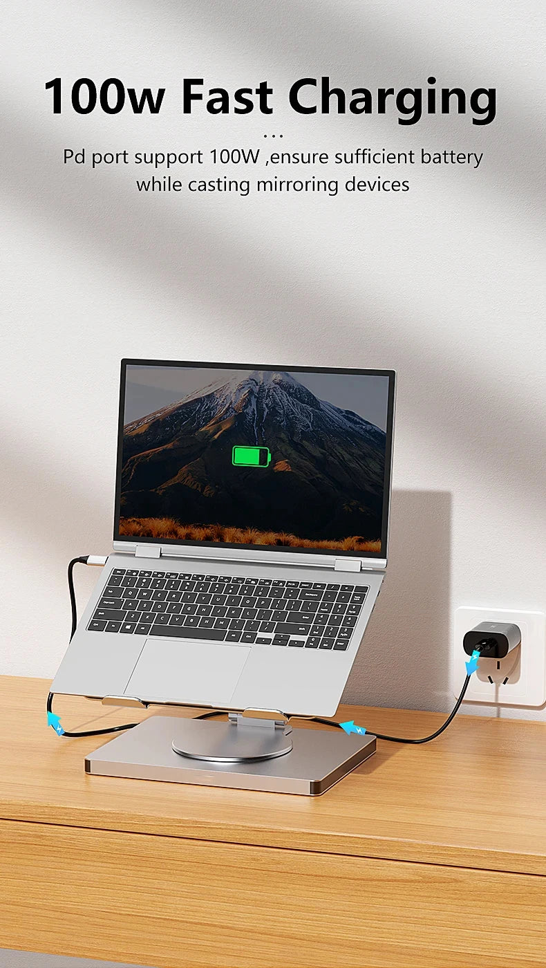 Laptop on a charging stand with power adapter and text about fast charging.