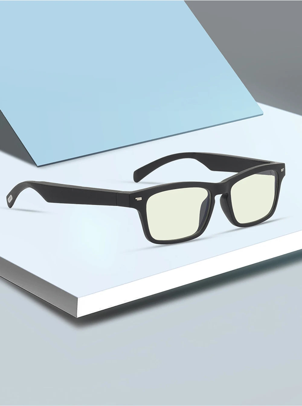 Black glasses with a blue light filter on a white surface