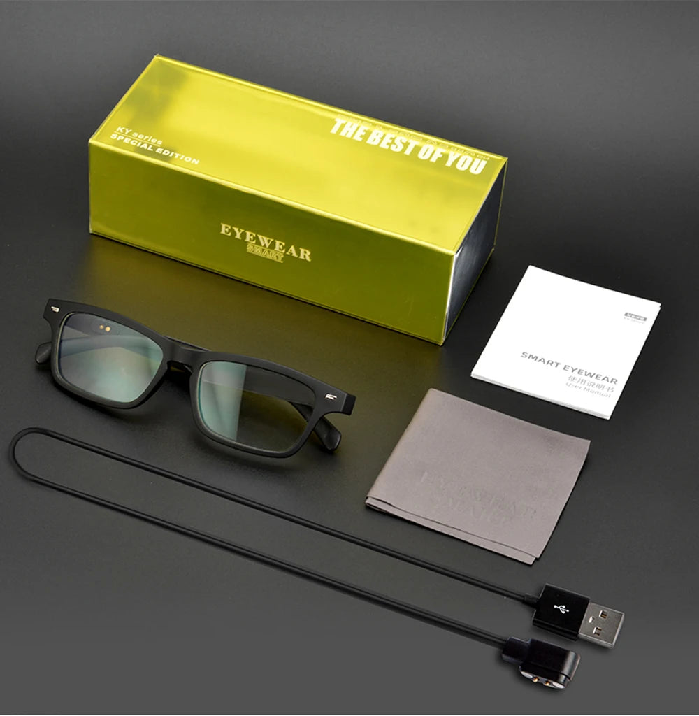 Eyewear product set with glasses, box, card, case, and cable on a dark surface